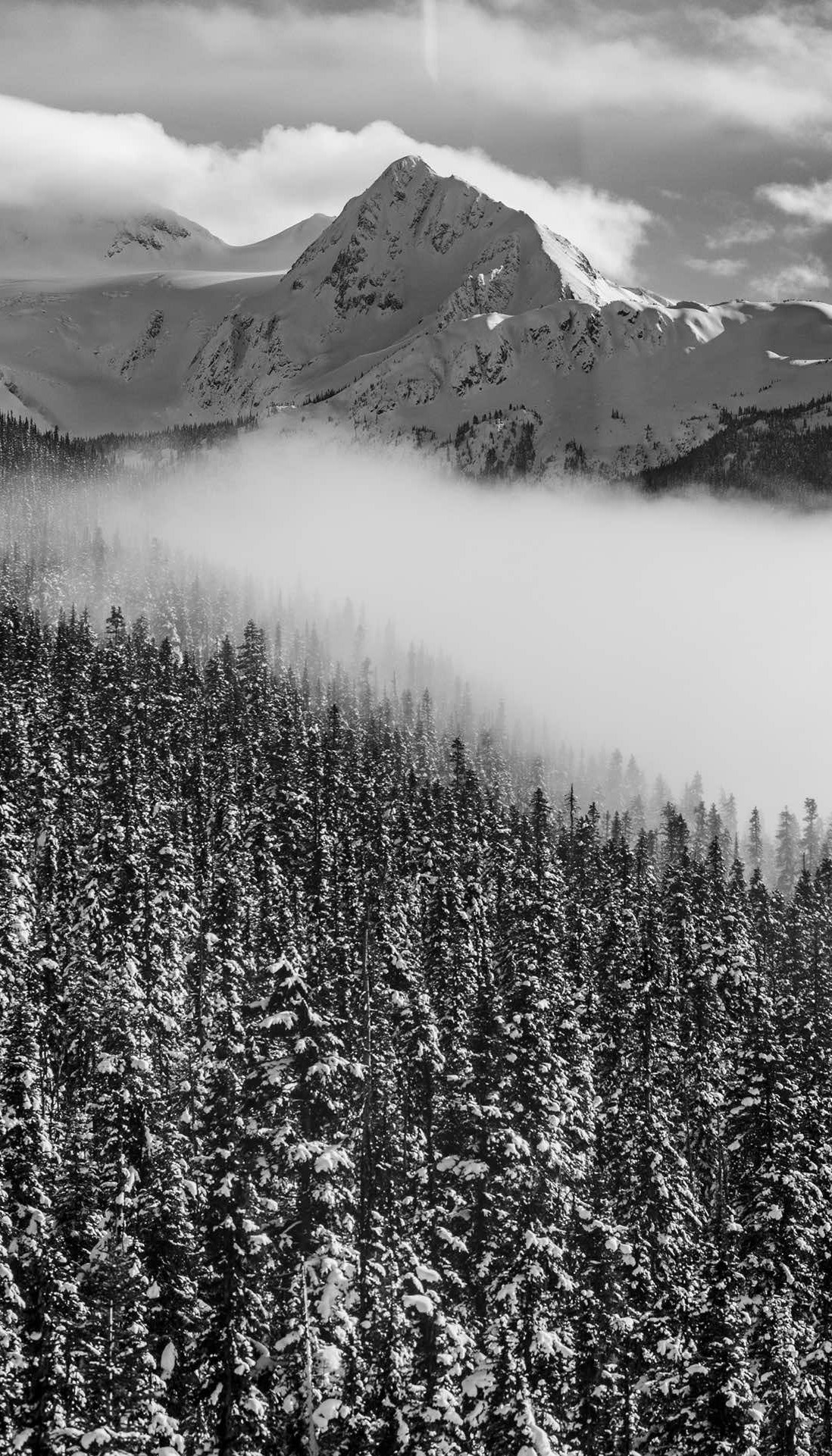 A Zermatt peak rising above a cloud inversion in the Mattertal